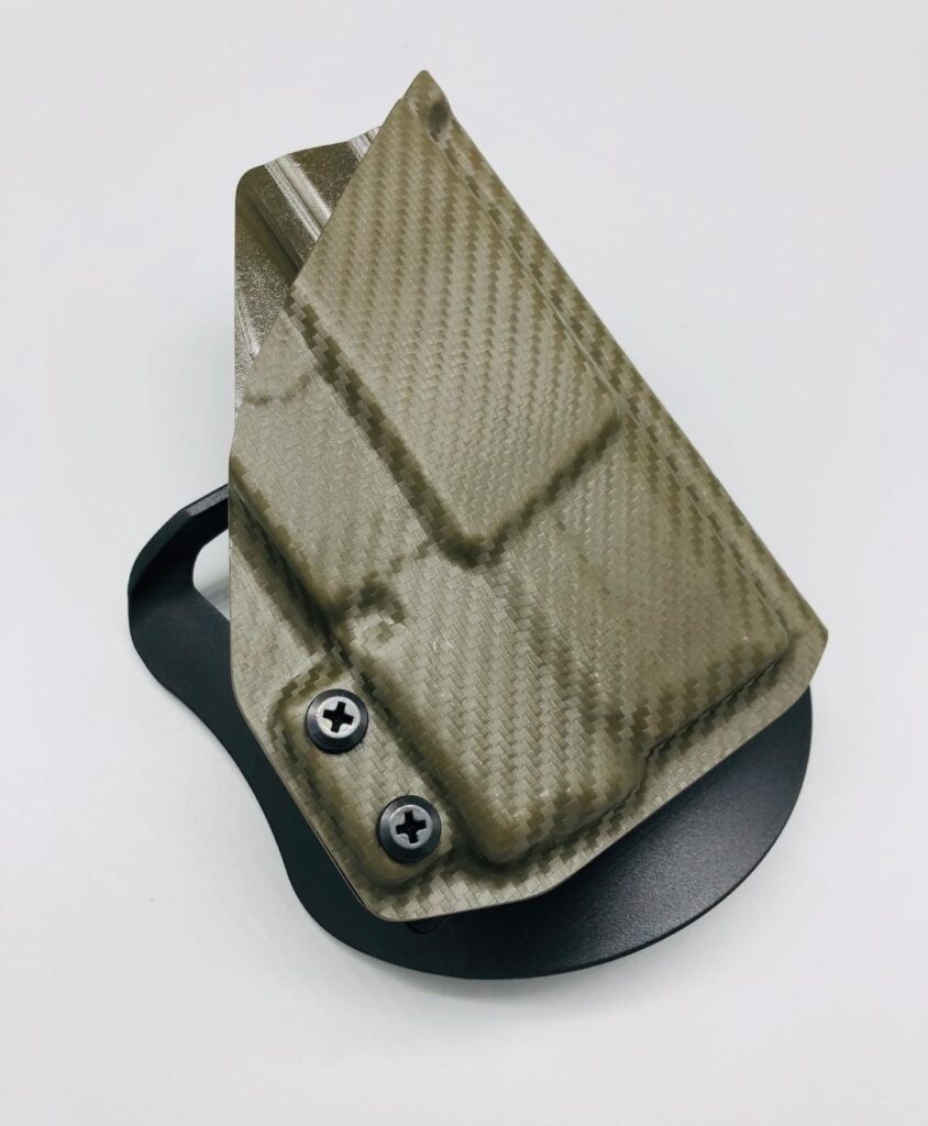 Tan carbon fiber Kydex paddle holster molded for a SIG P365 with a Streamlight TLR-6