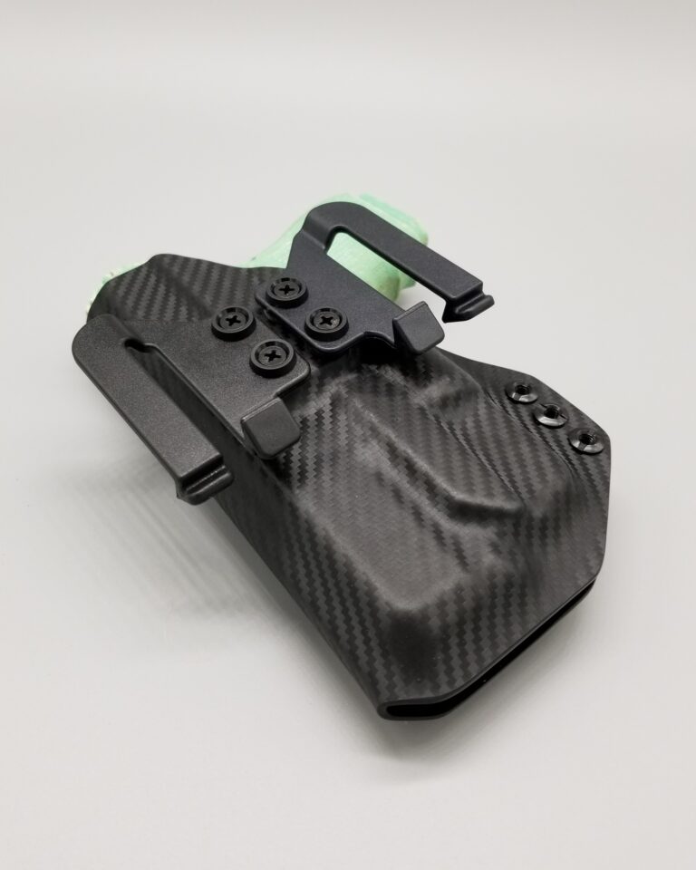 Black carbon fiber Hermes Series light-bearing Kydex holster with a green accent