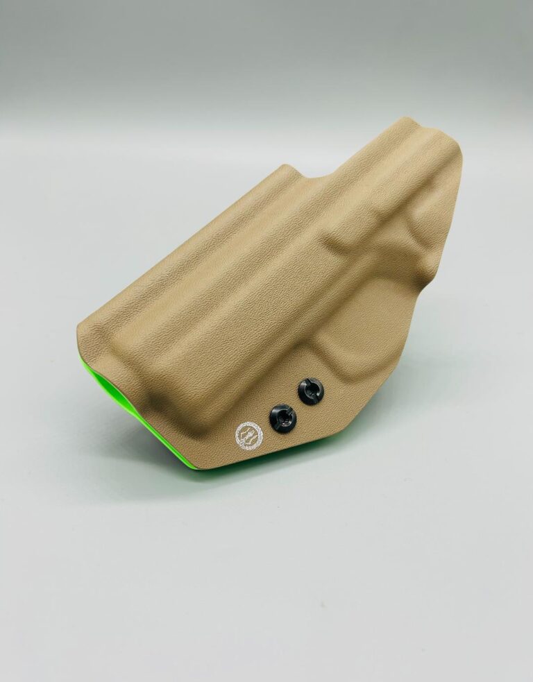 Tan Kydex dual-layer holster shell over a green inner layer