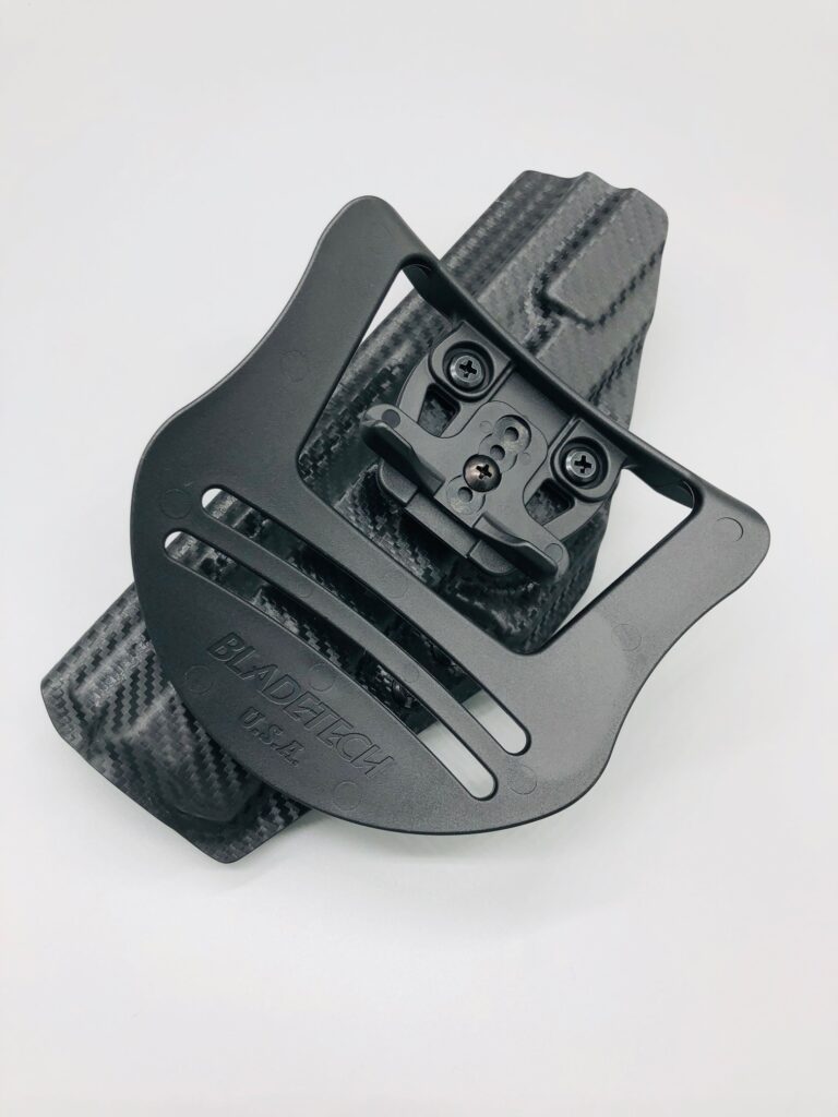 Black carbon fiber Kydex OWB holster mounted on a wide paddle backer