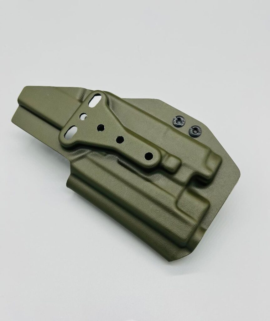 OD green light-bearing Kydex Veritas Series OWB holster with a black quick-detach mounting plate