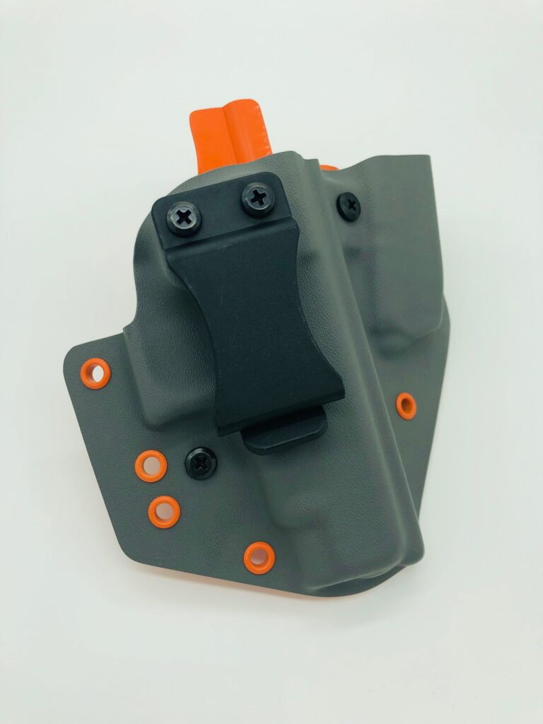 Grey Kydex Glock sidecar holster with orange hardware by Neptune Concealment