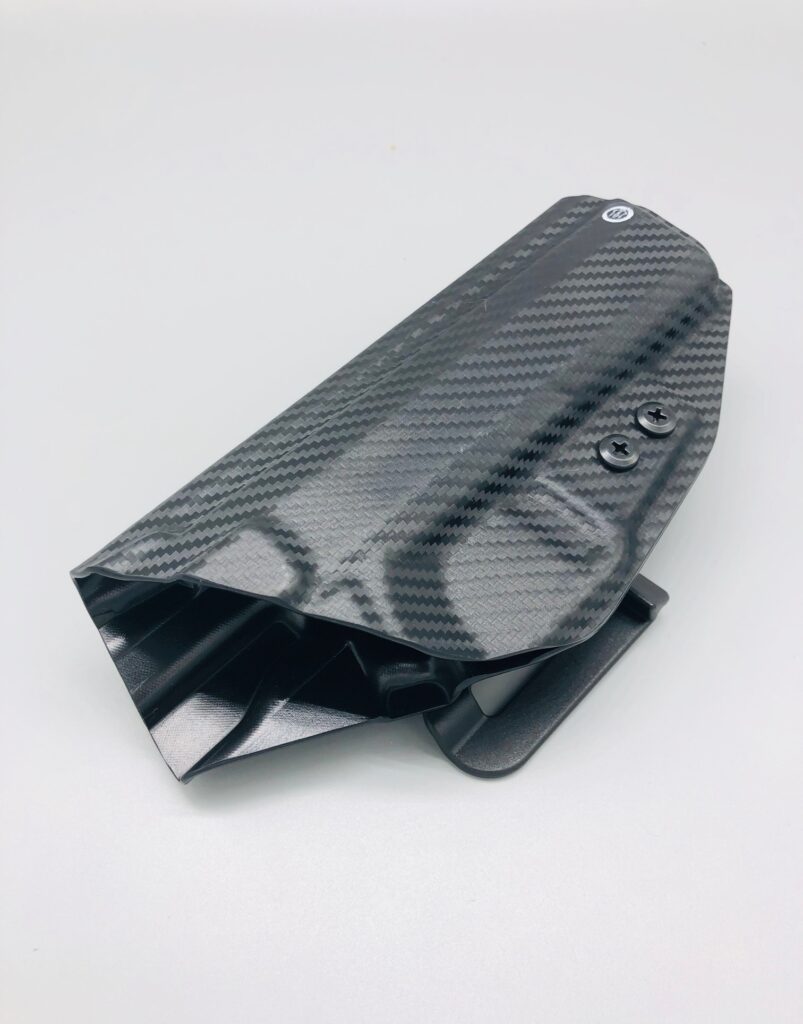 Black carbon fiber Kydex holster shell viewed end-on from the muzzle