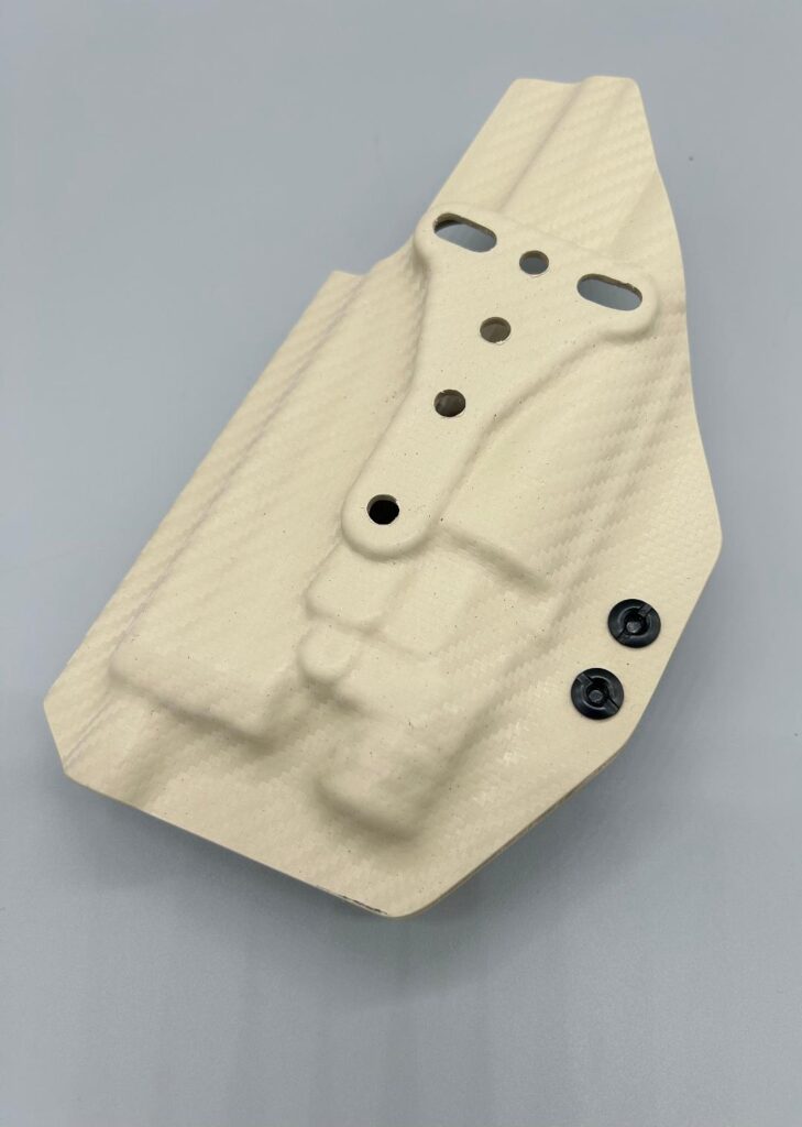 Sand carbon fiber Kydex Veritas Series OWB holster shell showing its mounting holes and light channel