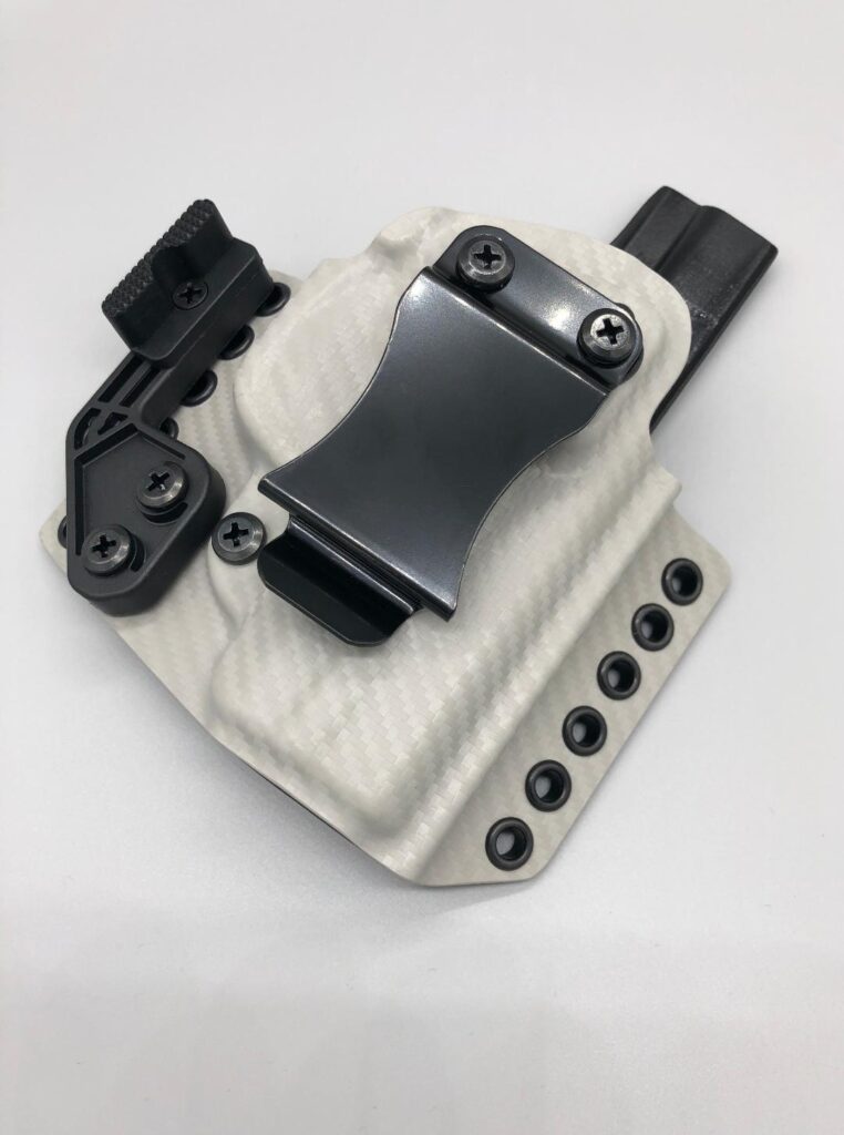 White and grey Theseus 2.0 Kydex IWB holster with a concealment claw