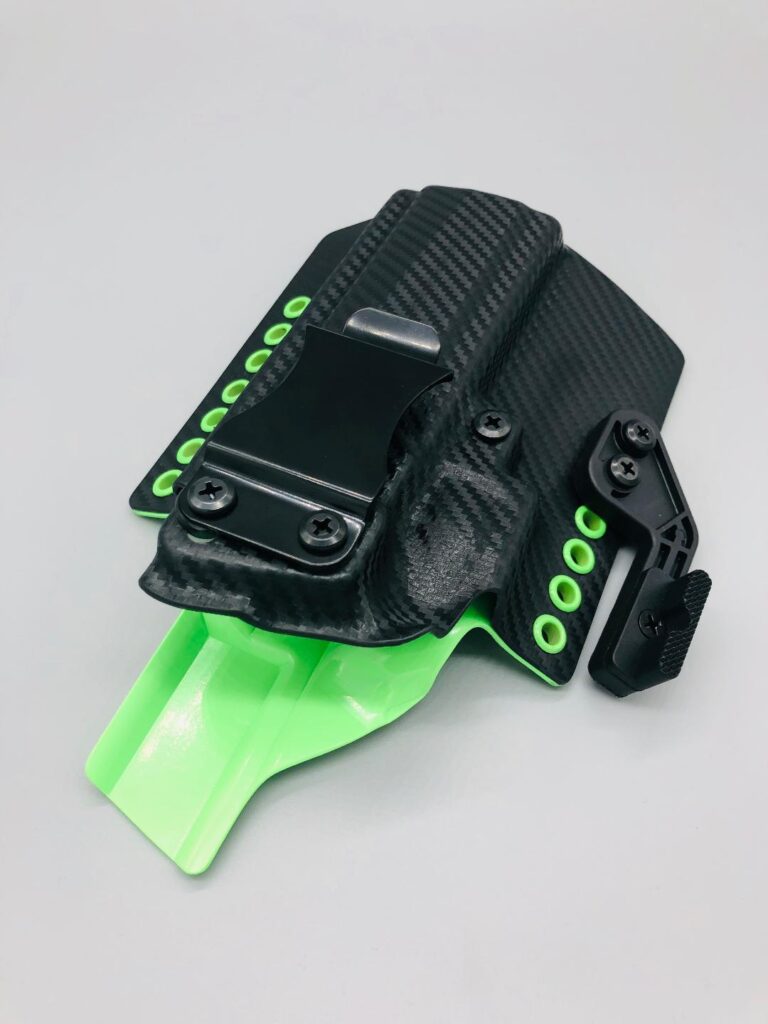 Black carbon fiber Theseus 2.0 Kydex IWB holster with a neon green claw and green hardware