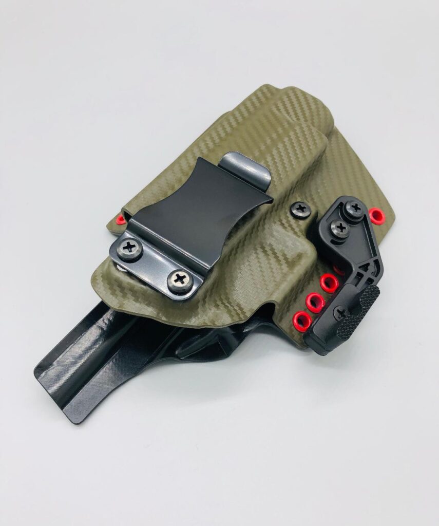 OD green carbon fiber Theseus 2.0 Kydex IWB holster with red hardware and a mounting wing