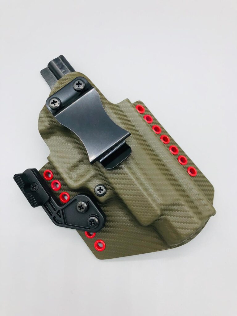 Olive carbon fiber Theseus 2.0 Kydex IWB holster with red hardware and a mounting wing